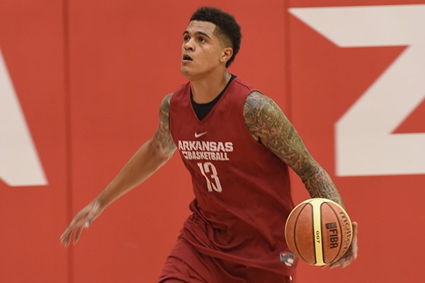 Arkansas forward Dustin Thomas goes through practice Monday, July 25, 2016, in Fayetteville. 