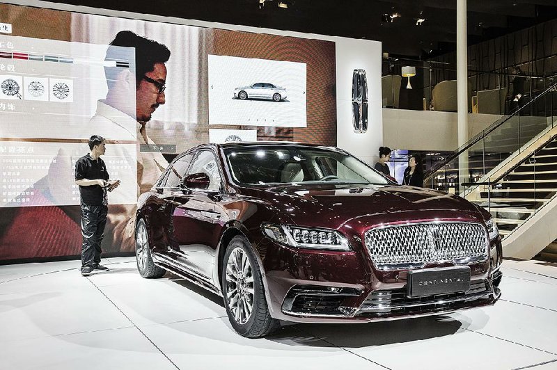 A Ford Motor Co. Lincoln Continental is displayed in April at the Beijing International Automotive Exhibition in China. Ford recorded a pretax loss of $8 million in Asia in the second quarter.