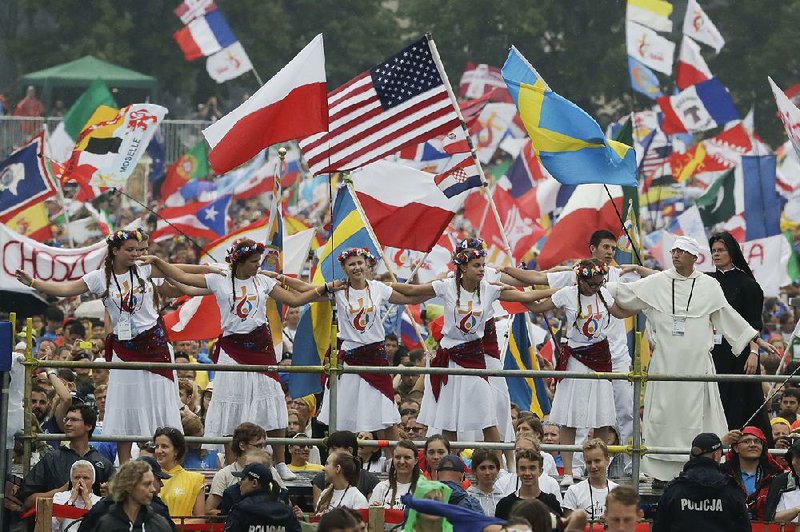 Participants in World Youth Days await the arrival Thursday of Pope Francis at Jordan Park in Krakow, Poland.
