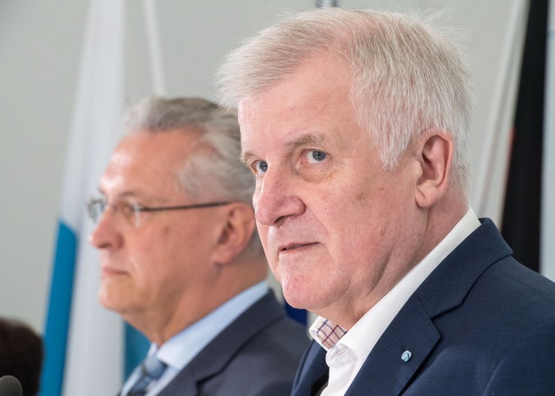 Bavarian governor Horst Seehofer,right, and Bavaria's Interior Minister, Joachim Herrmann attend a meeting of the Bavarian cabinet ,in Gmund, Germany, Tuesday, July 26, 2016.   