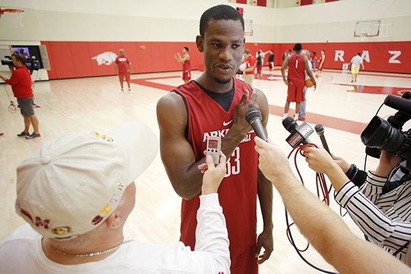 Arkansas center Moses Kingsley speaks to reporters prior to practice Monday, Oct. 5, 2015, in Fayetteville. 