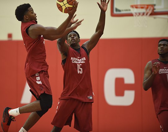 NWA Democrat-Gazette/J.T. Wampler MACON HAY: Arkansas' Daryl Macon takes a shot while Jaylen Barford (15) defends during practice Monday in Fayetteville. Junior college transfers Macon and Barford are two of several Razorback newcomers trying to gel as the Hogs prep for next month's four-game exhibition trip to Spain.
