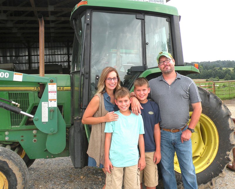 The Bart Schulz family of Sidney is the 2016 Sharp County Farm Family of the Year. The family includes Brandi Schulz, from left, Jonah Finster, Briley Finster and Bart Schulz. They raise cattle, chickens and hay on their 484-acre farm.