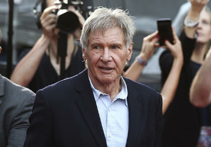 In this December 10, 2015 file photo, Harrison Ford greets fans during a Star Wars fan event in Sydney. 
