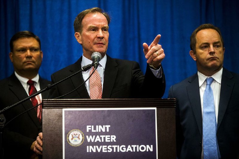 In charging the six state employees, Michigan Attorney General Bill Schuette said Friday in Flint, Mich., that each tried to “bury or cover up” the truth about the lead contamination of the city’s water. 