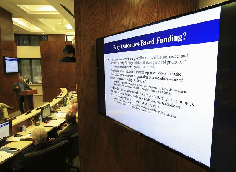 Brett Powell, outgoing director of the Arkansas Department of Higher Education, makes a presentation Friday to the Higher Education Coordinating Board about a new state funding model. 