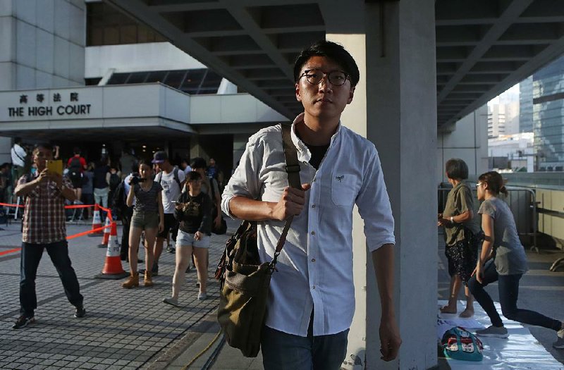 Activist candidate Edward Leung leaves a Hong Kong court this week after filing a challenge regarding an election officer’s questions on his political stance. 
