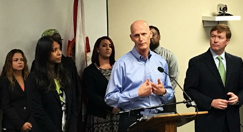 Florida Gov. Rick Scott, at a news conference Friday in Orlando, confirms that four people contracted the Zika virus from mosquitoes in the state. 