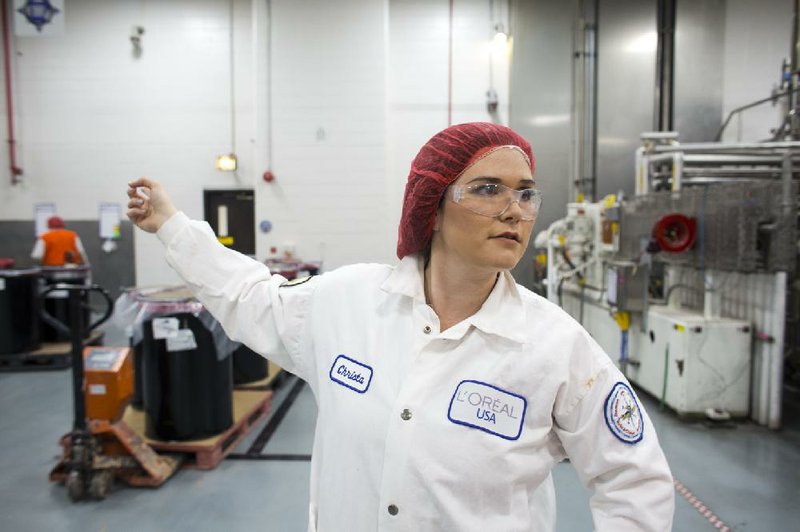 Christa Rowland, head of process expertise at the L’Oreal Maybelline plant in North Little Rock, conducts a factory tour. She says there is a “six out of 10 chance” the mascara in a woman’s purse was made at the plant. 