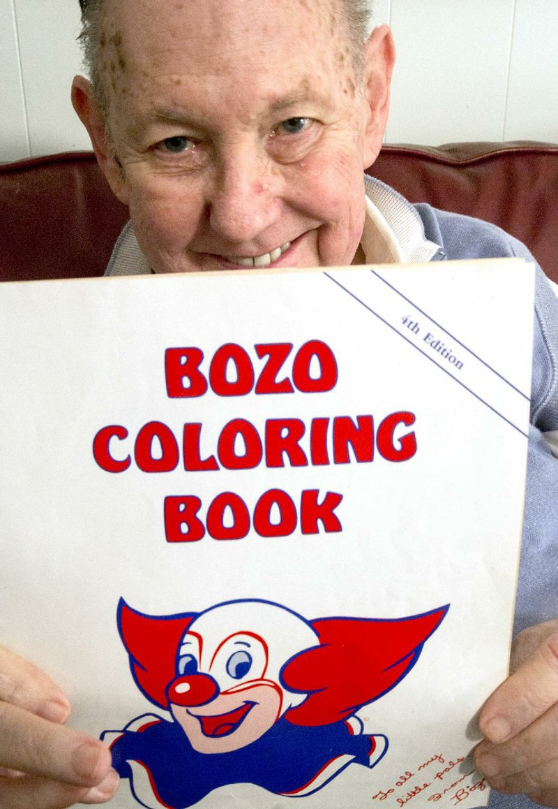 Gary Weir looks through some memorabilia from his days as Bozo, Arkansas’ most famous clown.