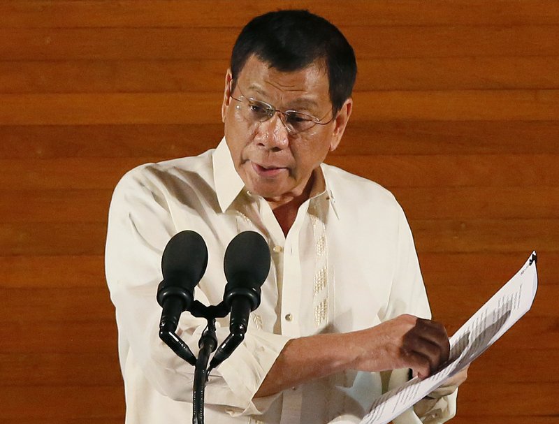 In this Monday, July 25, 2016 file photo, Philippine President Rodrigo Duterte delivers his first State of the Nation Address before the joint session of the 17th Congress in suburban Quezon city, northeast of Manila, Philippines.