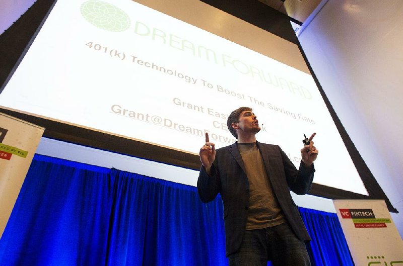 Grant Easterbrook, chief executive officer of Dream Forward, explains the company’s low-cost 401(k) retirement plan to guests at the FinTech Accelerator program’s Global Investor Demo Day at the Clinton Presidential Center in Little Rock on Wednesday. 