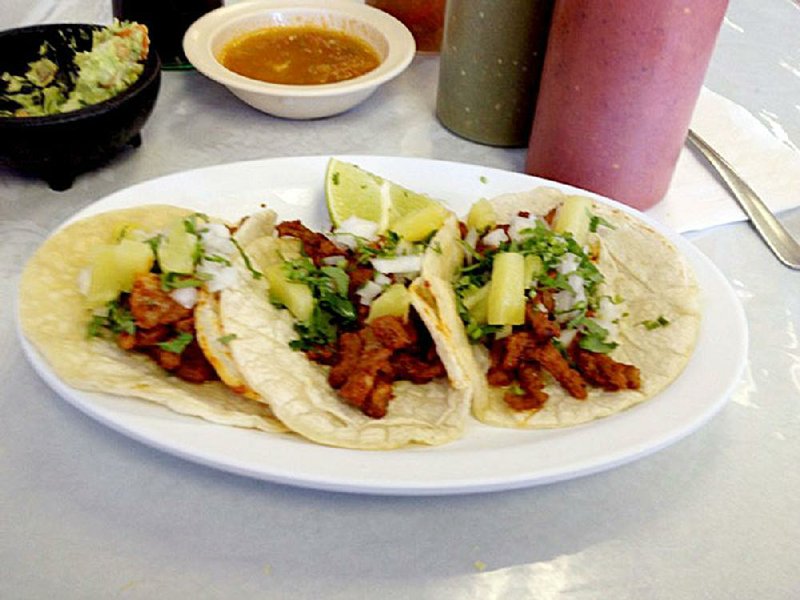 Tacos al pastor are among the authentic Mexican menu items at Taqueria el Palenque. 