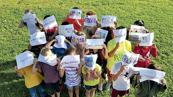 Northwest Arkansas Children’s Shelter residents “take a stand” against child abuse in a recent awareness campaign. The “Golf Classic, Presented by General Mills” on Aug. 15 will help support the emergency shelter in Vaughn. 