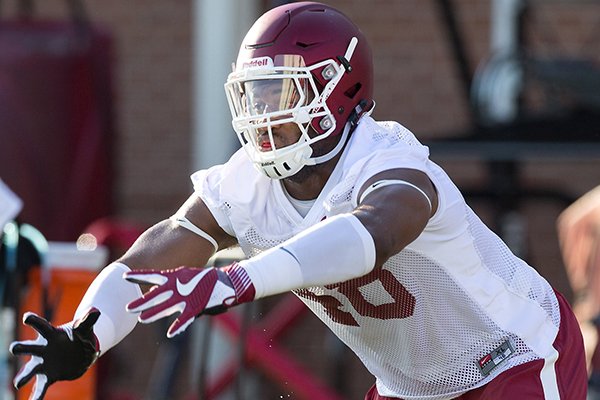 Arkansas defensive end Deatrich Wise goes through drills in practice Thursday, Aug. 4, 2016, in Fayetteville. 