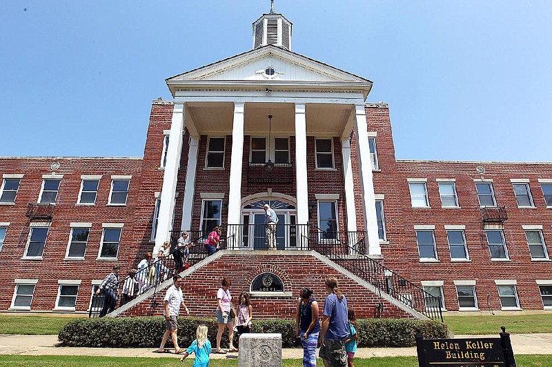 Arkansas Democrat-Gazette/BENJAMIN KRAIN -- 8/5/2016--
People tour the Helen Keller Memorial Building at the Arkansas School for the Blind and Visually Impaired during an Arkansas Historic Preservation Program's monthly Sandwiching in History tour on Friday. Internationally-known blind educator Helen Keller delivered a speech at the 1939 dedication ceremony of the Colonial Revival-style building.