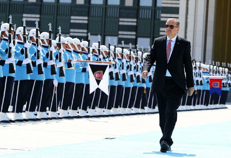 Turkey’s President Recep Tayyip Erdogan reviews the military honor guard before a meeting Friday with President Nursultan Nazarbayev of Kazakhstan at the presidential palace in Ankara. 