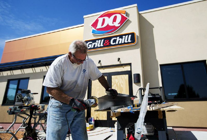 FILE — Brooks Montgomery works on a piece of steel at the Dairy Queen Grill & Chill in Farmington. 