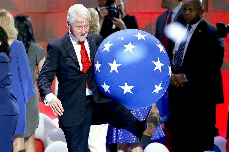 Former President Bill Clinton kicks a Bubba’s Balloonacy balloon at the conclusion of the Democratic National Convention in Philadelphia last month. Fayetteville-born Otus the Head Cat’s award-winning column of humorous fabrication appears every Saturday.