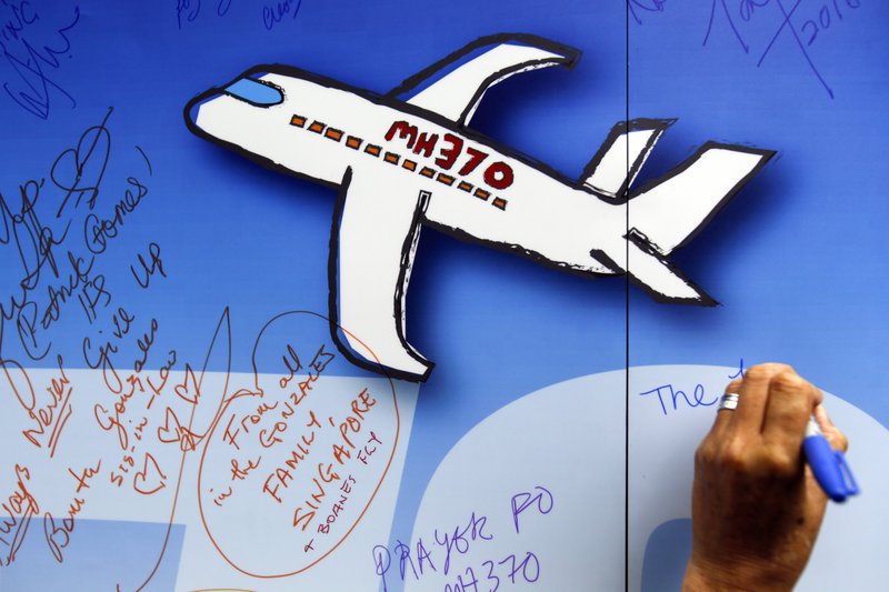 In this March 6, 2016, file photo, well wishes are written on a wall of hope during a remembrance event for the ill fated Malaysia Airlines Flight 370 in Kuala Lumpur, Malaysia. 