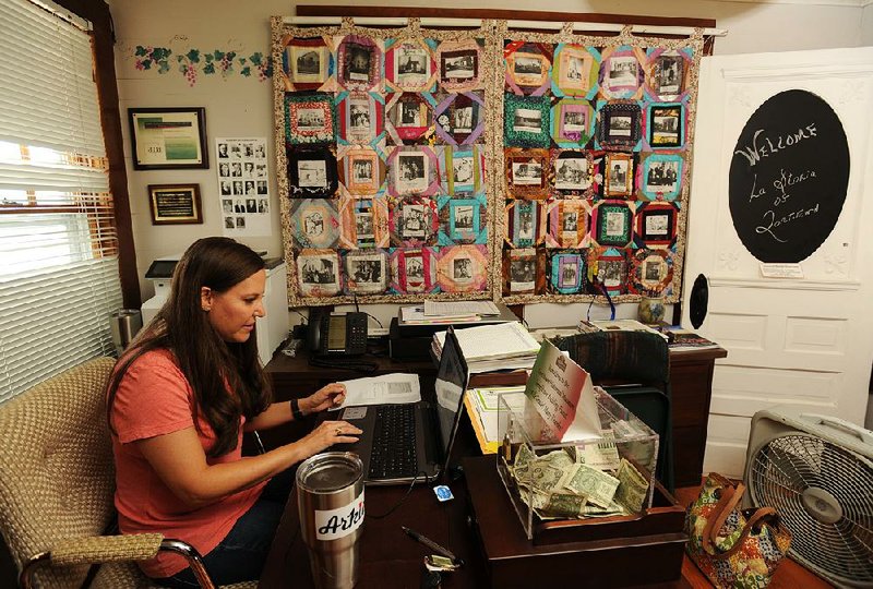 Rebecca Howard, a member of the Tontitown Historical Museum board, works Friday at the museum, which preserves the history of the Italian immigrants who founded the town. 