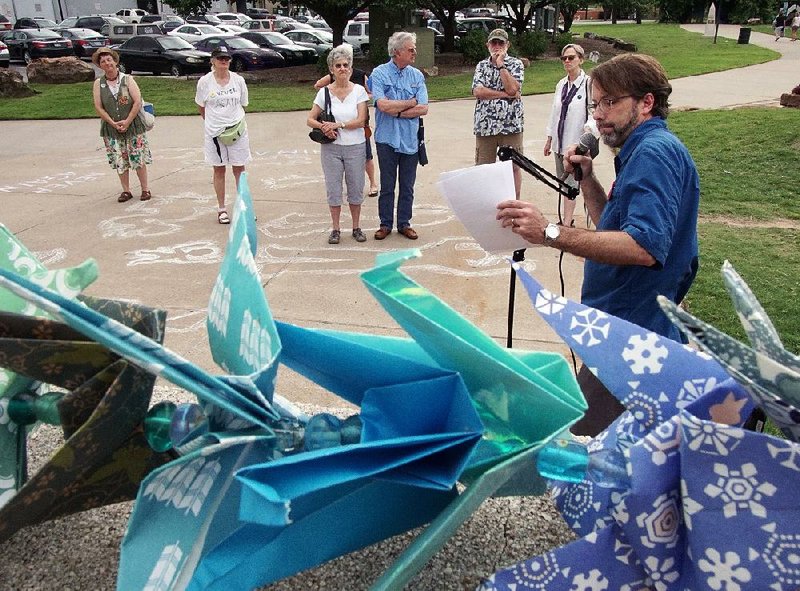 Bob Estes, an officer in the Arkansas Coalition for Peace and Justice, speaks Saturday at Little Rock’s Riverfront Park during an event commemorating the bombing of Hiroshima 71 years ago during World War II.