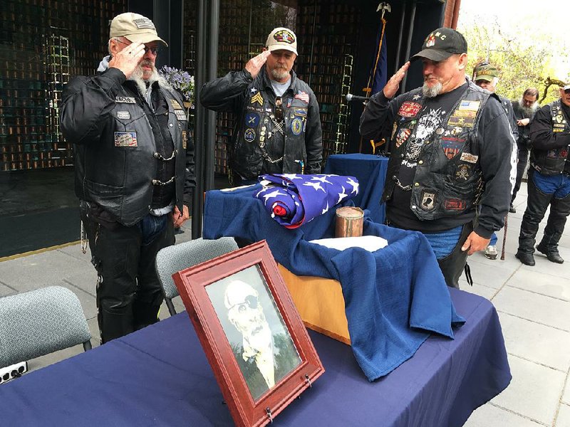 Steve West (from left), Milt Harden and Dan Halverson of Patriot Guard Riders salute the remains of Maine Civil War soldier Jewett Williams on Monday before the group’s journey from Salem, Ore., to Williams’ home state to bury his ashes with military honors at Togus National Cemetery. 