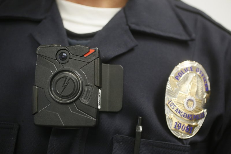  In this Jan. 15, 2014, file photo a Los Angeles Police officer wears an on-body camera during a demonstration in Los Angeles. 