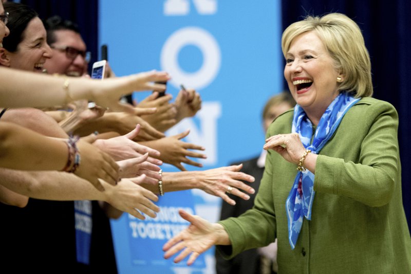 In this Aug. 3, 2016, photo, Democratic presidential candidate Hillary Clinton arrives at a rally at Adams City High School in Commerce City, Colo.