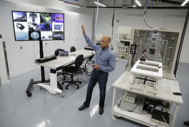 Jay Parikh, Facebook’s vice president of engineering, talks about the hardware research and development lab known as Area 404 during a tour last week at Facebook headquarters in Menlo Park, Calif.