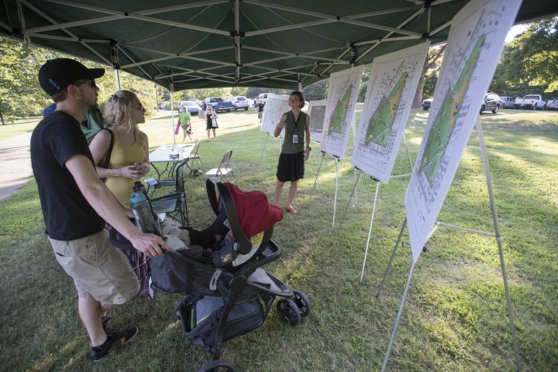 Tom and Casey Brennan of Fayetteville talk with Alison Jumper on Thursday about the Gulley Park Master Plan before the final Gulley Park Concert of the season.