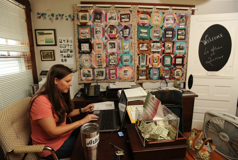 Rebecca Howard, a member of the Tontitown Historical Museum Board, works Friday at the Tontitown Historical Museum in Tontitown.