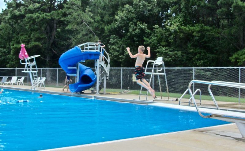 The swimming pool at Petit Jean State Park includes a diving board for visitors who want to take the leap.