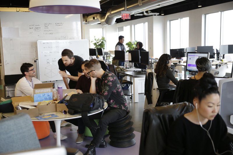 Jet.com employees work at the company’s Hoboken, N.J., office in May. Wal-Mart agreed to purchase the online retail newcomer for about $3.3 billion.