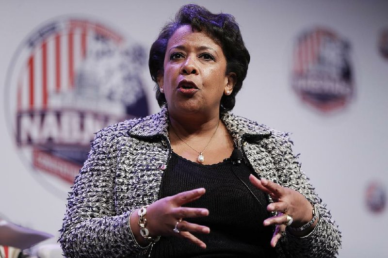 Attorney General Loretta Lynch speaks to the National Association of Black Journalists and National Association of Hispanic Journalists at their convention in Washington, Thursday, Aug. 4, 2016. 