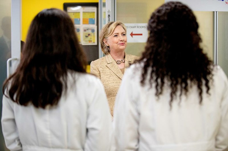 Hillary Clinton meets with doctors Tuesday at a health clinic in Miami, where she urged immediate congressional action on battling the Zika virus. “Everybody has a stake in this,” Clinton said.