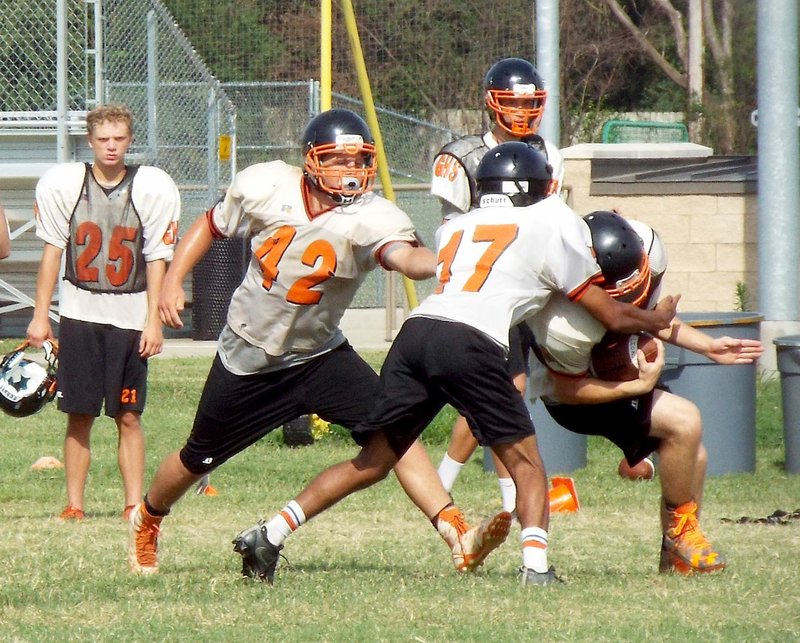 Photo by Randy Moll The Gravette Lions were getting ready for the upcoming football season on Friday (Aug. 5, 2016). Coaches were working with their players on offensive plays and, on the part of the defense, defending against those plays during their morning practice on the high school practice field.