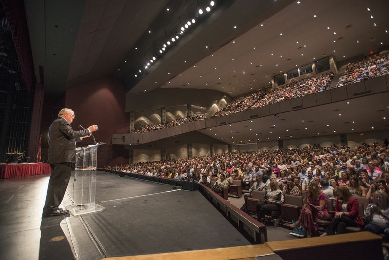 Springdale Superintendent Jim Rollins speaks Tuesday to more than 1,600 teachers packed into the Springdale High School Performing Arts Center. Springdale has the second largest school district in the state.