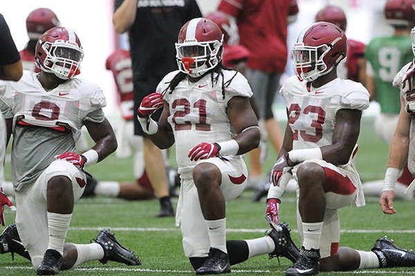 Arkansas linebacker Josh Williams (21) stretches during practice Tuesday, Aug. 9, 2016, at Walker Indoor Pavilion in Fayetteville. 