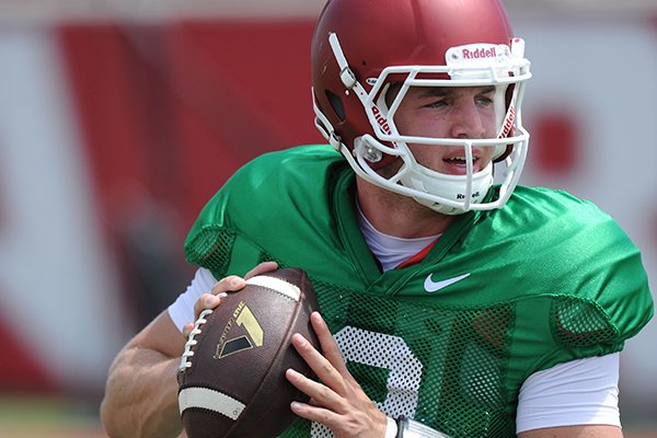 Arkansas quarterback Rafe Peavey participates in a drill during practice Saturday, Aug. 6, 2016, at the football practice field on the university campus in Fayetteville. 