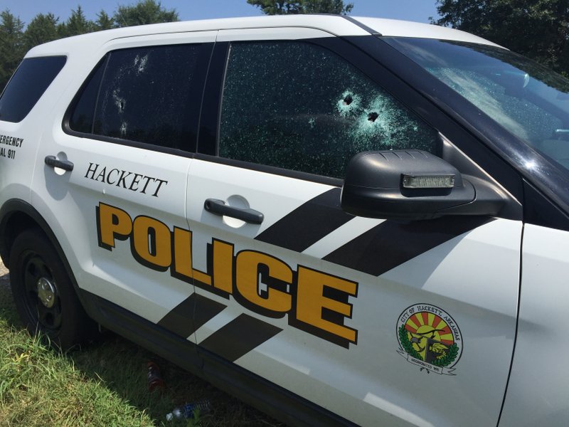 A Hackett police vehicle Wednesday in Sebastian County. Hackett Police Chief Darrell Spells and sheriff's deputy Bill Cooper were shot Wednesday morning.