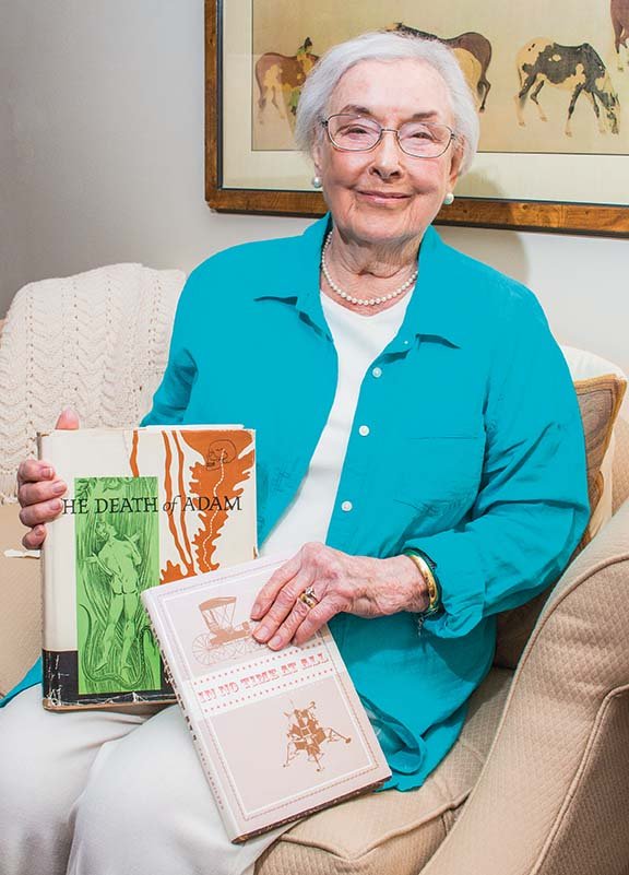 Rowena Malone of Conway, who turned 101 on Saturday, sits on her couch holding two of the books she helped create as managing editor of the Iowa State University Press. After she retired, she recorded books for the blind and received an Iowa’s Governor’s Award for her work.