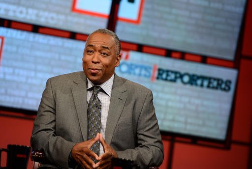 In this May 12, 2013, photo provided by ESPN Images, John Saunders poses on the set of "The Sports Reporters" in Studio A in Bristol, Conn. 