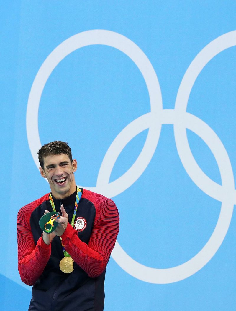Michael Phelps couldn’t help but laugh after winning his 20th Olympic gold medal Tuesday night.