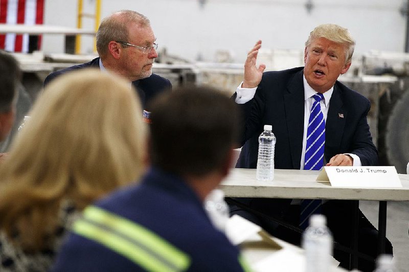 Donald Trump, ignoring the firestorm over his Second Amendment comments, talks about coal Wednesday at a discussion on mining in Glade Spring, Va. Trump worked to stay on message but said the criticism was more evidence the election was rigged. 