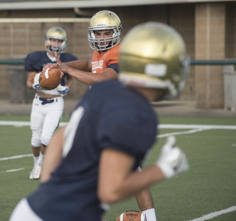 Conner Reese, third-year starting quarterback for Shiloh Christian High School, looks for his receiver Tuesday during practice.