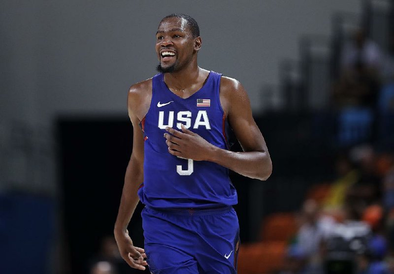 United States' Kevin Durant smiles after making a three-point basket during a basketball game against China at the 2016 Summer Olympics in Rio de Janeiro, Brazil, Saturday, Aug. 6, 2016. 