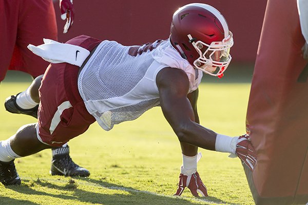 Arkansas linebacker De'Jon Harris goes through practice Thursday, Aug. 4, 2016, in Fayetteville. 