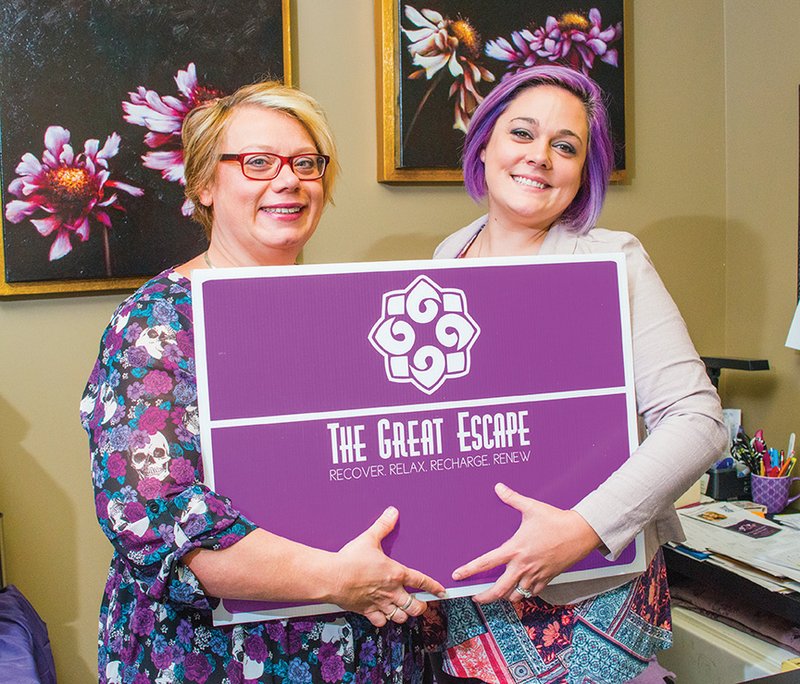 Carrie Curtis, left, executive director of the Women’s Shelter of Central Arkansas, and Taylor Watts, a board member and chairwoman of The Great Escape, hold a sign for the fundraiser. The annual event will take place from 9 a.m. to 3 p.m. Aug. 27 at the Conway Expo Center and Fairgrounds, 2505 E. Oak St. Offerings will include haircuts, massages and manicures for $10 each, as well as free health screenings, shopping, a fashion show and food. Tickets are $5 and can be purchased at the door or at www.greatescape2016.eventbrite.com.