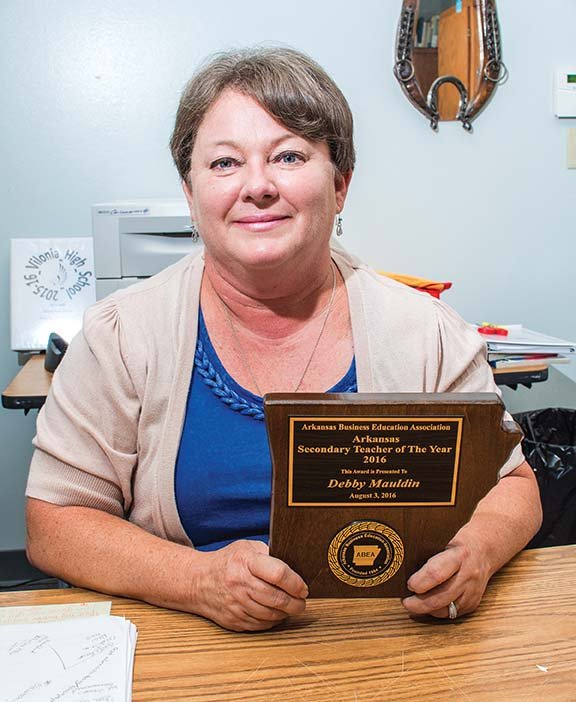 Debby Mauldin, who is starting her 20th year as a teacher at Vilonia High School, was named Secondary Business Teacher of the Year by the Arkansas Business Education Association on Aug. 3 at its annual conference, a day she missed because of knee surgery. “This is truly 
an honor, and I wasn’t expecting it,” Mauldin said. She said peers 
nominate and choose the recipient.